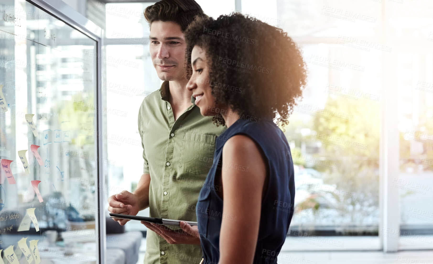 Buy stock photo Tablet, brainstorming and people in office with glass wall, creative idea or discussion for marketing. Team, planning and strategy in workplace with digital tech, sticky note and advertising project.