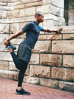 Buy stock photo Outdoor, athlete and stretching for fitness, serious and exercise for body care, endurance or health. Black person, training and getting ready for run with warm up, workout and runner with balance