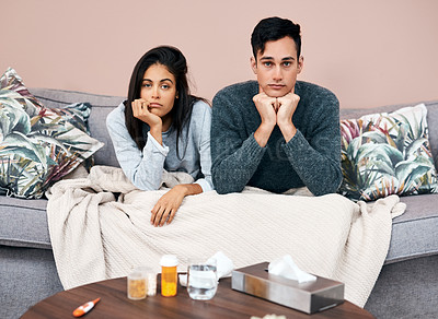 Buy stock photo Sick, couple and portrait with blanket on sofa for medical recovery, flu or cold together in home. Man, woman or influenza with tissue box, medication or pills on couch for fever, sinus or allergy