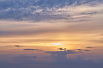 Sunrise, orange and blue sky with clouds for weather, atmosphere and empty space. Natural, background and air with sunshine in morning for aesthetic, wallpaper and scenic view for nature or climate