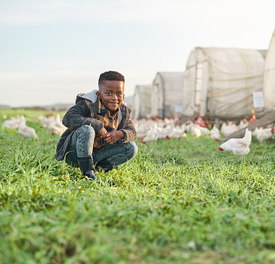 Buy stock photo Portrait, child and growth in chicken farm, sustainability or birds for poultry production in nature. Outdoor, agriculture and black kid with smile in countryside, space and animals for meat industry