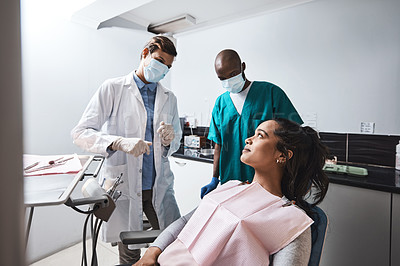 Buy stock photo Clinic, consulting and woman with dentist in chair for teeth cleaning, oral hygiene and treatment. Healthcare, talking and orthodontist with patient for dental care, whitening and medical service