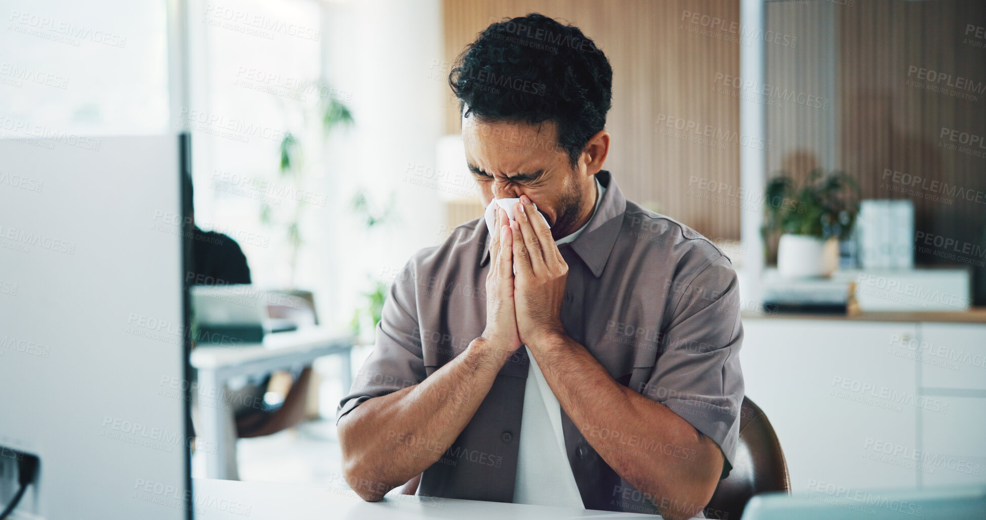Buy stock photo Tissue, blowing nose and business man in office with flu symptoms, illness and sinus infection at desk. Startup, workplace and sick person with sneeze for health crisis, cold and allergy by computer