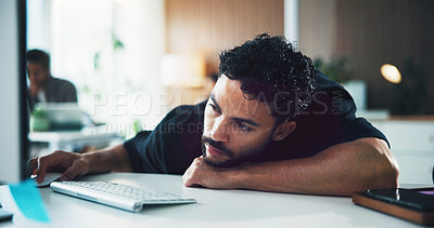 Buy stock photo Tired, employee and man with computer, office and reporter with article on web, creative and fatigue. Newsroom, burnout and person with low energy for story submission, online and exhausted on table