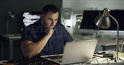 Buy stock photo Repair, man and thinking with laptop in office at night for diagnostic solution, hardware testing and IT. Deadline, technician and tech at desk for troubleshooting, trace signal and problem solving