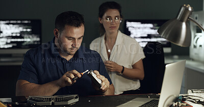 Buy stock photo Hard drive, repairs and technician with manager in office for maintenance, upgrade or fixing server. Laptop, equipment and male engineer building switch board with electric database in workplace.