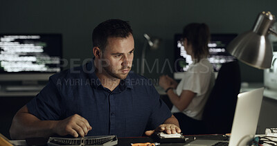 Buy stock photo Night, laptop and man with hardware for IT maintenance, repair and diagnostics for software. Technology, technician and team of workers with tools for troubleshooting, system test or programming