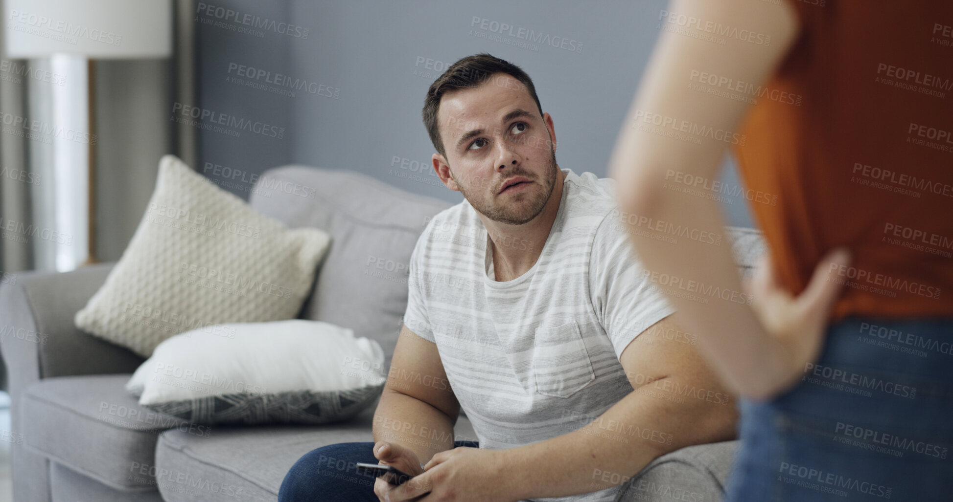 Buy stock photo Couple, secret and argument with phone in home for cheating affair, toxic relationship or privacy. Man, woman or spying with mobile smartphone for separation, trust issue or tension together in house