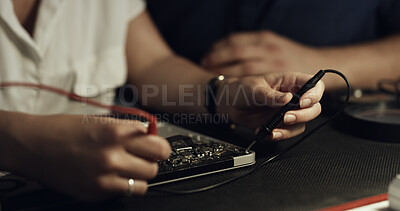 Buy stock photo Soldering, team or hands in workshop with circuit board, guidance or wiring repair in hardware check. Electronics, people or engineers with tech, testing advice or collaboration in system fix.