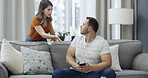 Argument, upset and people on sofa in home with relationship problem, cheating or affair conflict. Fighting, conversation and man with woman for marriage disagreement in living room at apartment.