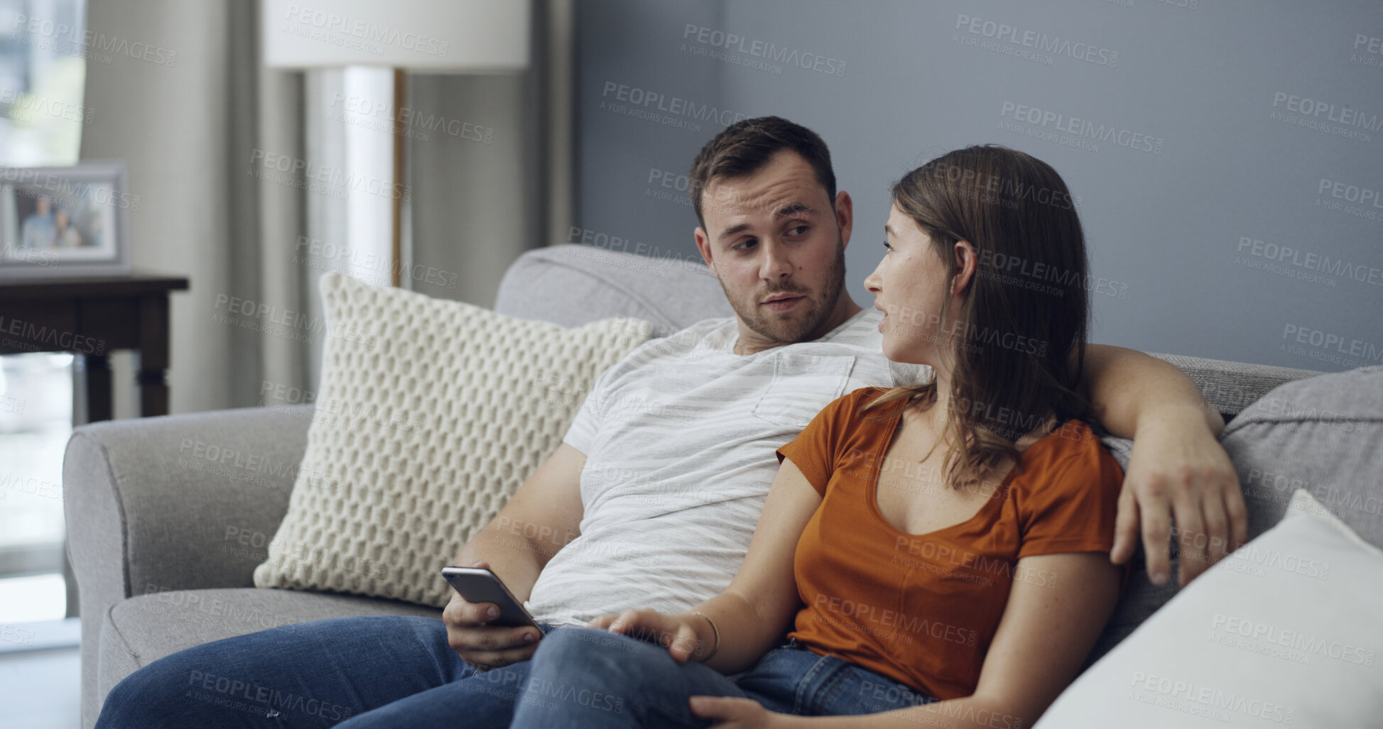 Buy stock photo Argument, phone and couple on sofa in home with relationship problem, cheating or affair conflict. Fighting, conversation and man with woman for marriage disagreement in living room at apartment.