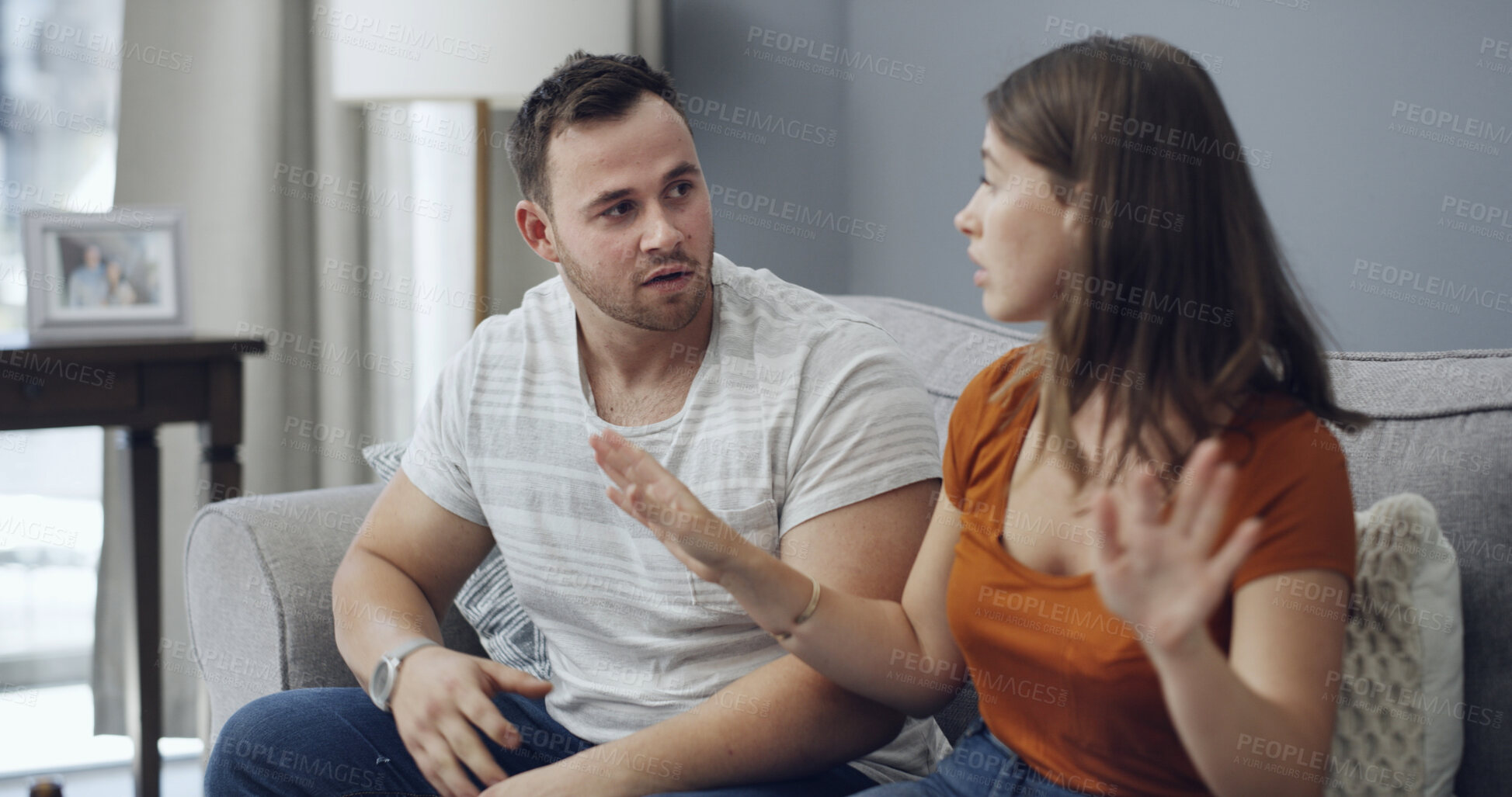Buy stock photo Fighting, upset and couple on sofa in home with relationship problem, cheating or affair conflict. Argument, conversation and man with woman for marriage disagreement in living room at apartment.