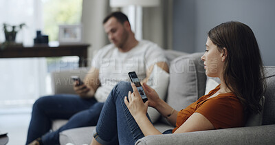 Buy stock photo Phone, relax and couple on sofa in home with texting, networking or chatting on mobile app. Technology, reading and man with woman on cellphone for social media together in living room at house.