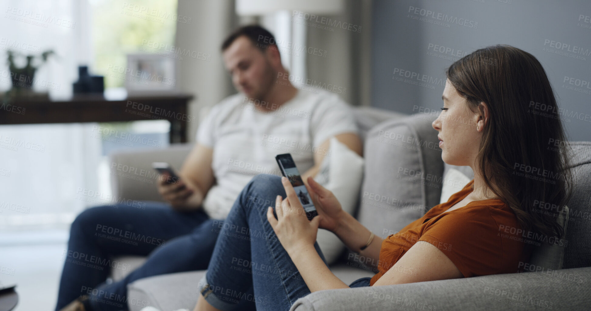 Buy stock photo Phone, relax and couple on sofa in home with texting, networking or chatting on mobile app. Technology, reading and man with woman on cellphone for social media together in living room at house.