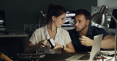 Buy stock photo Night, laptop and team with hardware for IT maintenance, repair and diagnostics for software. Technology, technician and engineer people with tools for troubleshooting, system test or programming