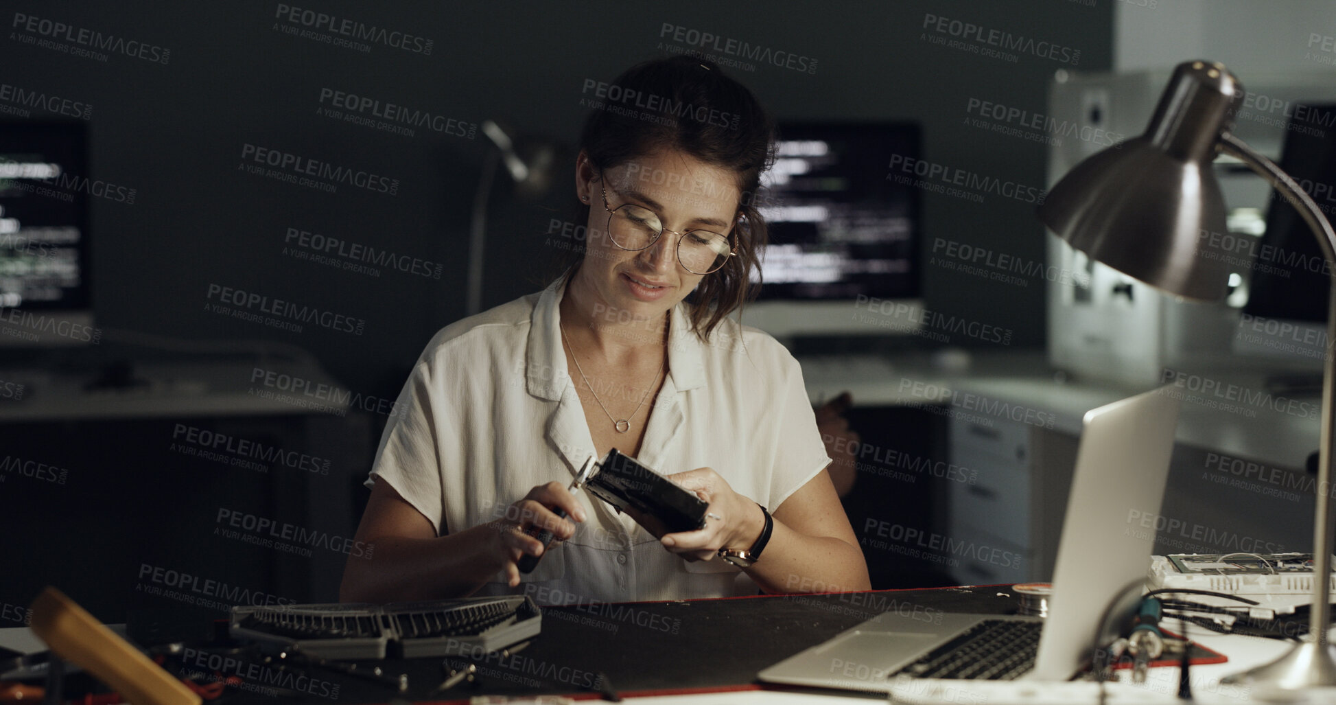 Buy stock photo Night, laptop and woman with hard drive for IT maintenance, repair and diagnostics for software. Technology, technician and engineer person with tools for troubleshooting, system test or programming