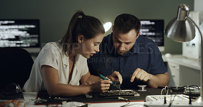 Buy stock photo Soldering, test or team in office with circuit board, repair or wiring guidance in hardware check. Electronics, people or engineers with tech, maintenance support or collaboration in system fix.