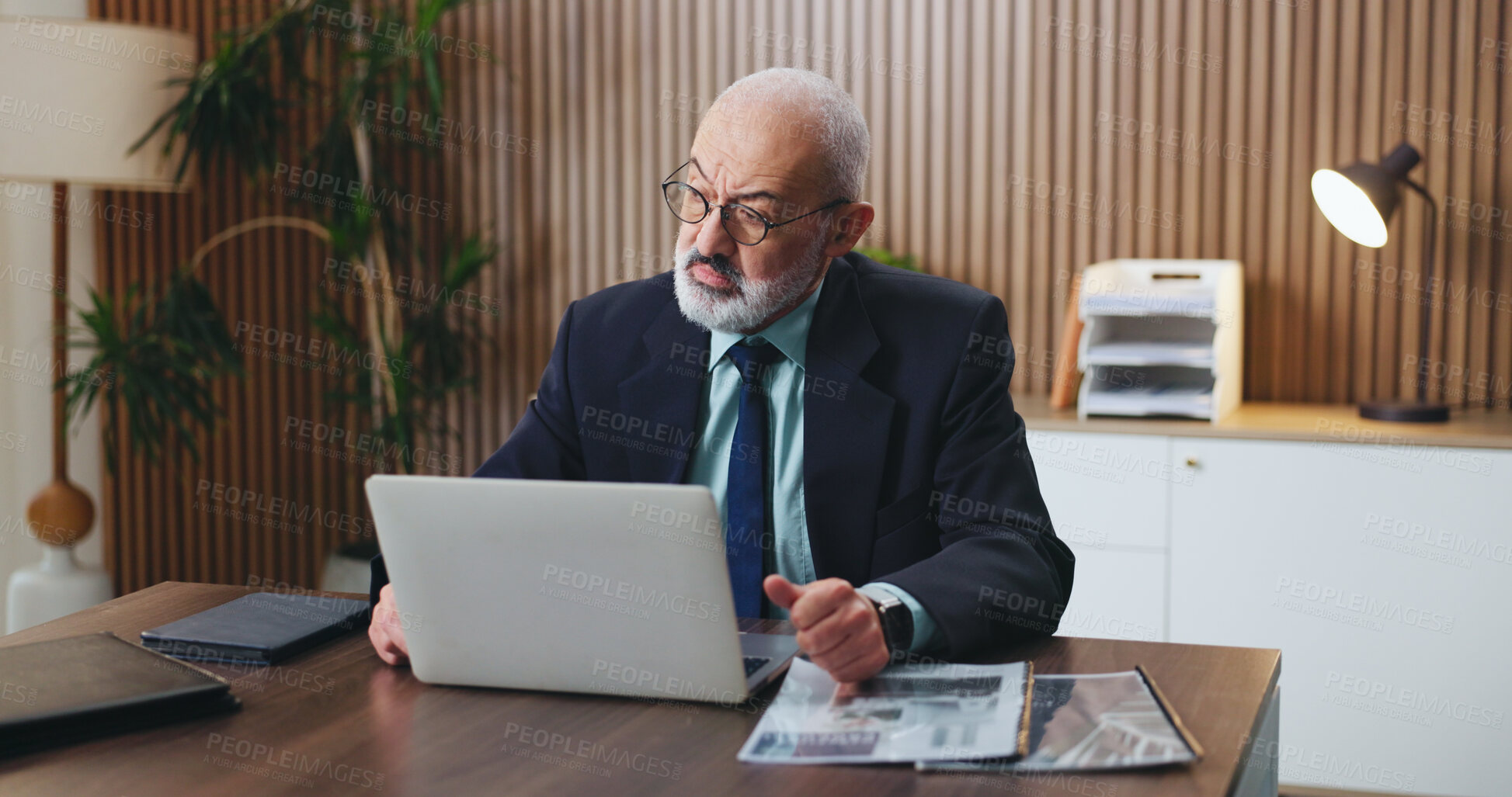 Buy stock photo Reading, glasses and businessman with laptop, office and mature attorney with legal research on web. Corporate, lawyer and person with eyewear in law firm, serious and case review with technology