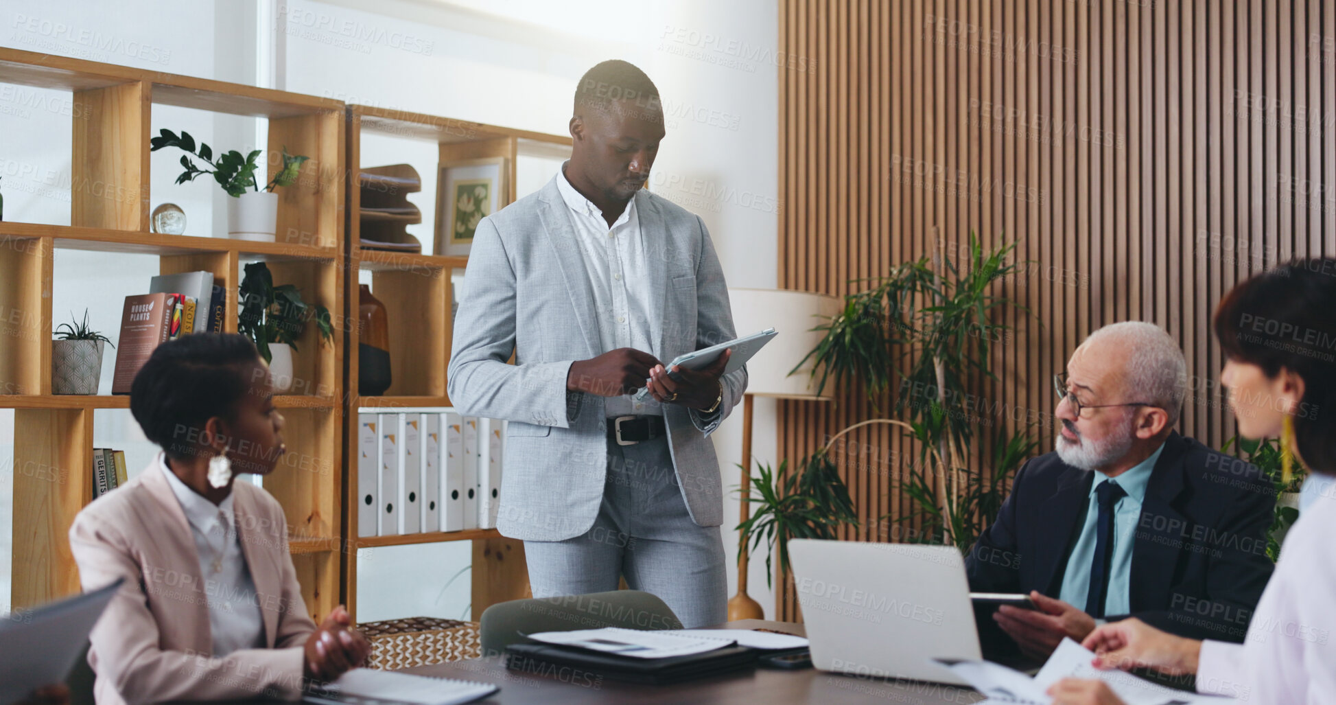 Buy stock photo Man, tablet and planning with team in office meeting for strategy with review, insight or talk at insurance company. Person, broker and group with tech on app, feedback or risk management at agency