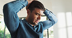 Frustrated, man and headache with stress in home for burnout, fatigue or financial mistake. Male person, loss or grief with migraine, fail or deadline for bad news, anxiety or depression in house