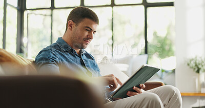 Buy stock photo Relax, man or scroll on tablet on sofa for social media post, streaming subscription or weekend break. Serious, person and tech in home for watching online videos, app download and email notification