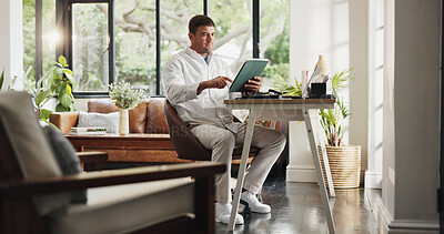 Buy stock photo Reading, remote work and man with tablet in home office for account manager, client portfolio and research. Admin, feedback and technology with person in living room for planning and website in house