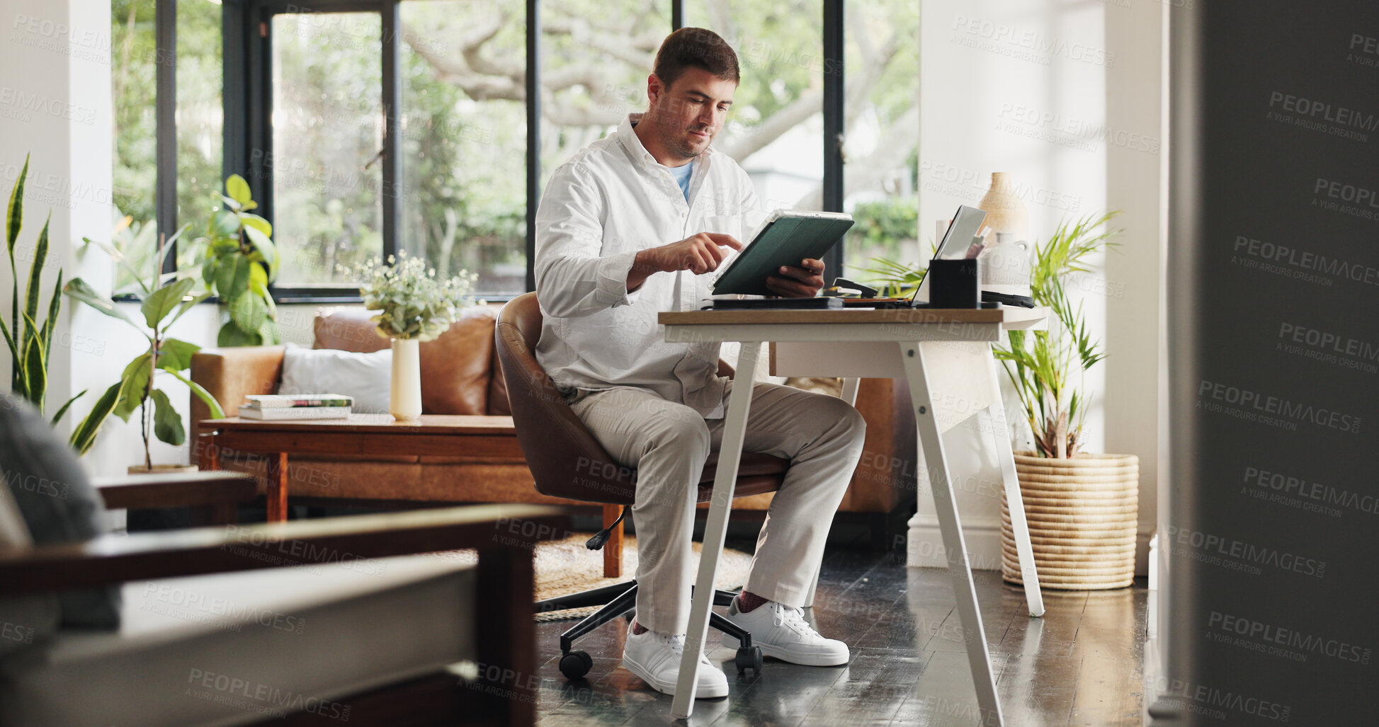 Buy stock photo Remote work, tablet and business man in home for planning, budget review and finance report. Consultant, house and person on tech for research, online proposal and website for financial advice