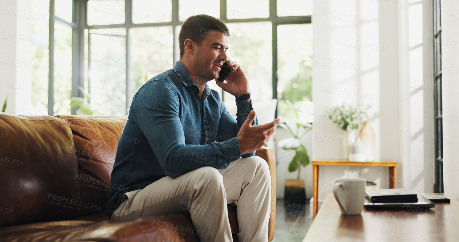 Buy stock photo Phone call, relax and man on sofa in house with communication, contact or networking in living room. Cellphone, happy and male person on mobile conversation for gossip or connection in apartment.