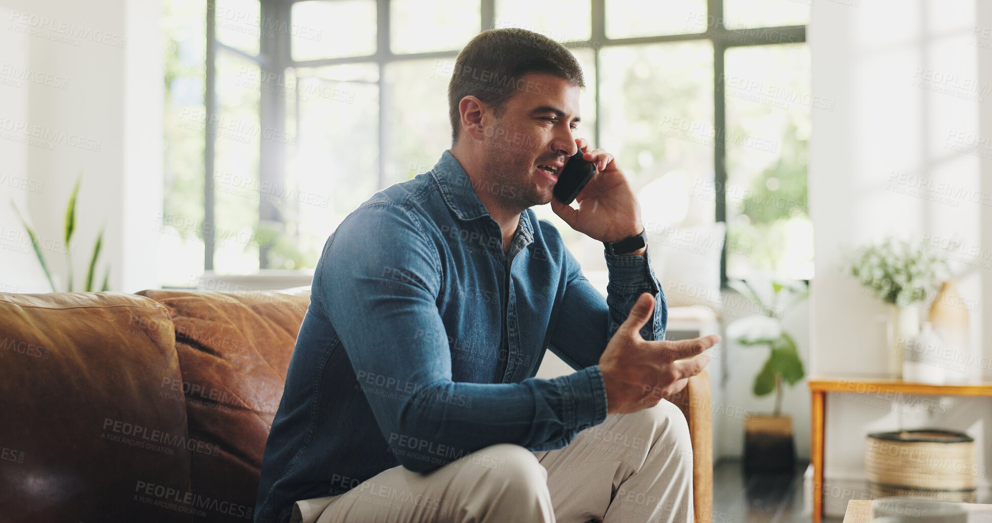 Buy stock photo Phone call, talking and man on sofa in home with communication, contact or networking in living room. Cellphone, happy and male person on mobile conversation for gossip or connection in apartment.