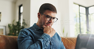 Buy stock photo Laptop, thinking and man with remote work on sofa for article idea, story inspiration and editing. Freelancer, journalist and thoughtful with tech in home for source insight, planning and blog review