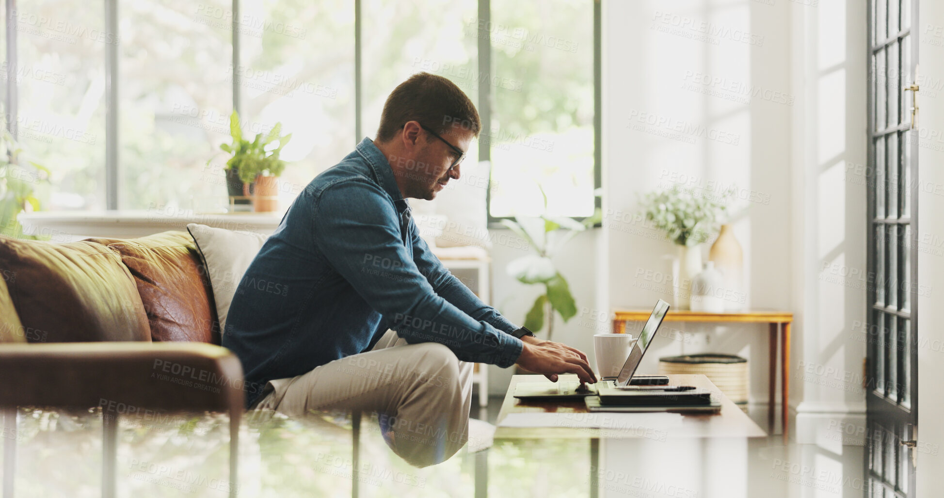 Buy stock photo Typing, remote work and man with laptop in home office for account manager, client portfolio and research. Admin, feedback and networking with person in living room for planning or thinking in house