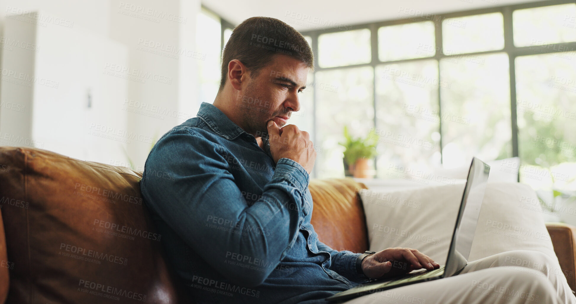 Buy stock photo Businessman, thinking and home with laptop on sofa for business idea, planning or strategy. Thoughtful, man or freelancer contemplating with computer on couch for remote work, network or research