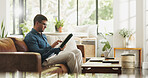 Typing, remote work and man with tablet in home for account manager, client portfolio and research. Admin, feedback and technology with person in living room for planning or thinking in house