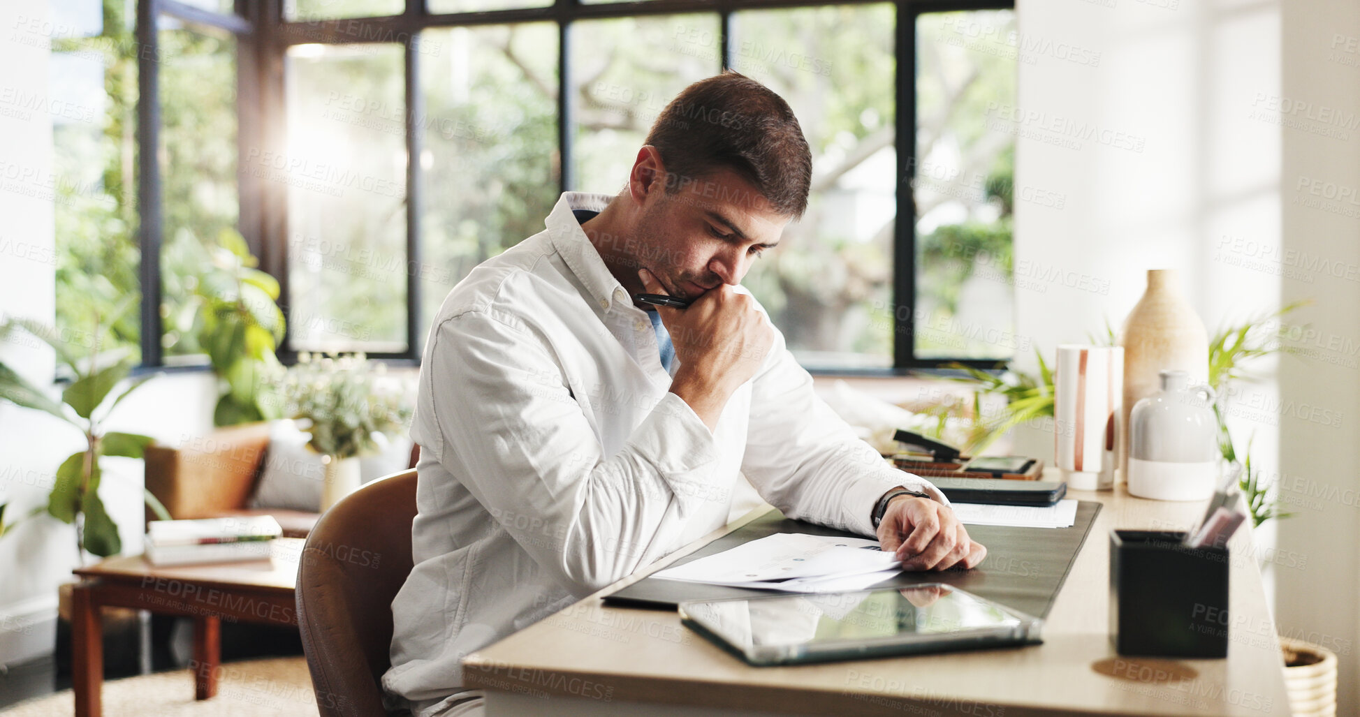 Buy stock photo Remote work, thinking and man in home with documents for planning, budget review and finance report. Consultant, reflection and person on tech for research, financial proposal or audit with paperwork