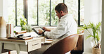 Remote work, tablet and man in home for finance report, budget review and planning for financial advice. Consultant, house and person on tech for research, online proposal or website for business