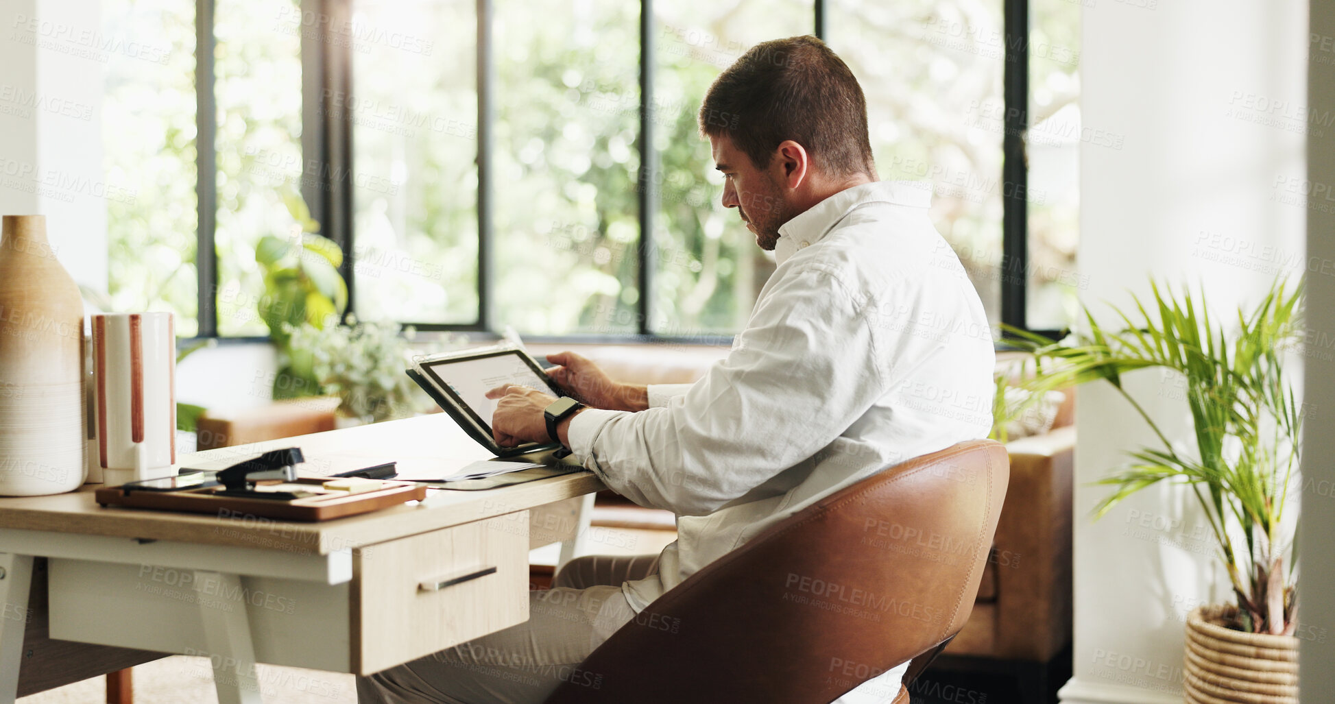 Buy stock photo Remote work, tablet and man in home for finance report, budget review and planning for financial advice. Consultant, house and person on tech for research, online proposal or website for business