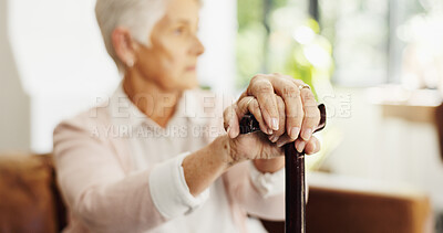 Buy stock photo Hands, walking stick and person on sofa in home with rest, recovery and reflection with injury in lounge. Elderly woman with disability, break or thinking for rehabilitation on couch in retirement