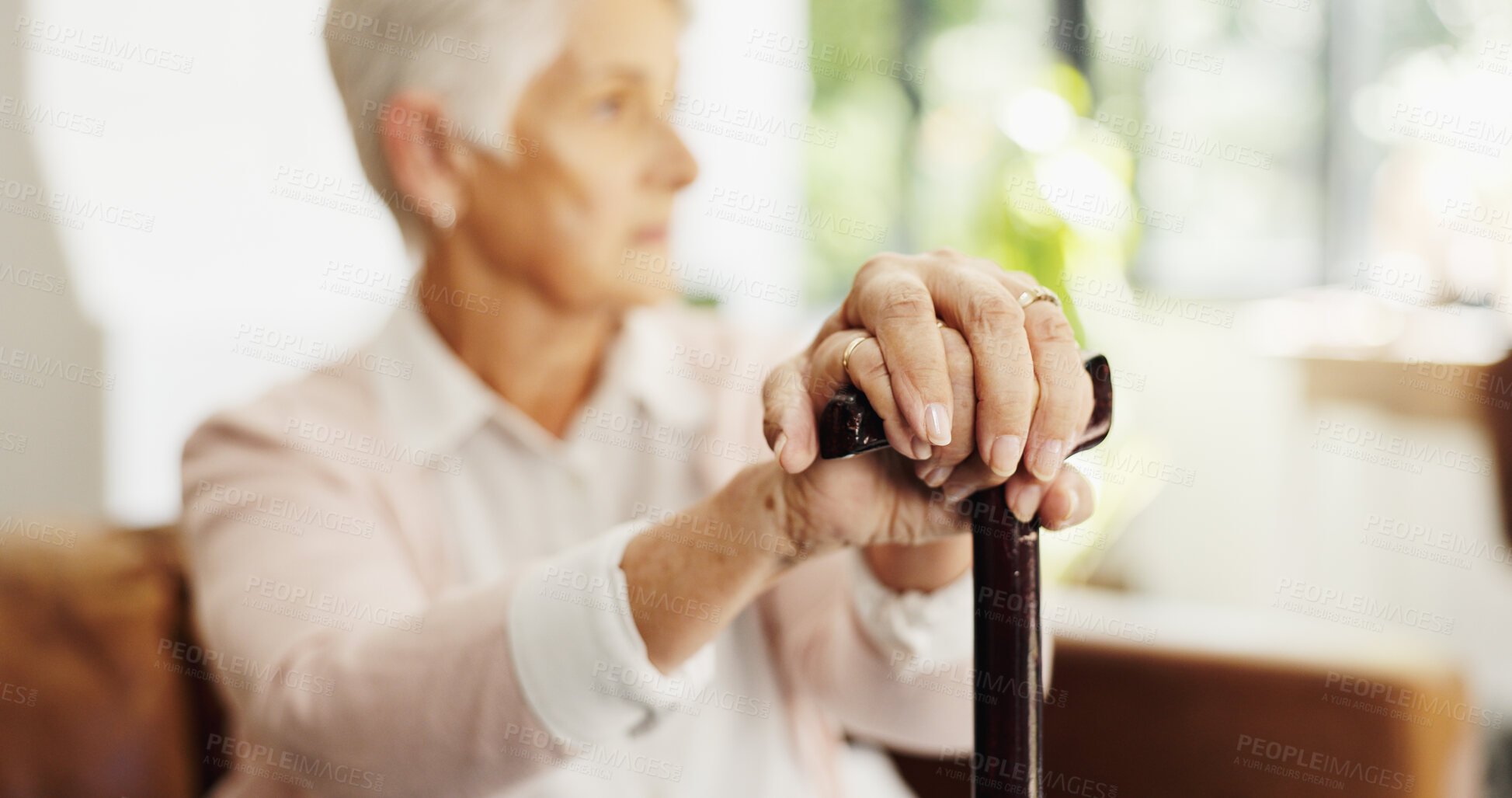 Buy stock photo Hands, walking stick and person on sofa in home with rest, recovery and reflection with injury in lounge. Elderly woman with disability, break or thinking for rehabilitation on couch in retirement