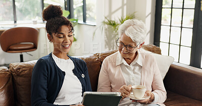 Buy stock photo Old woman, nurse and tablet on couch with tea for streaming, video or article in living room. People, caregiver and elderly person with tech, application and happy on sofa in retirement at house
