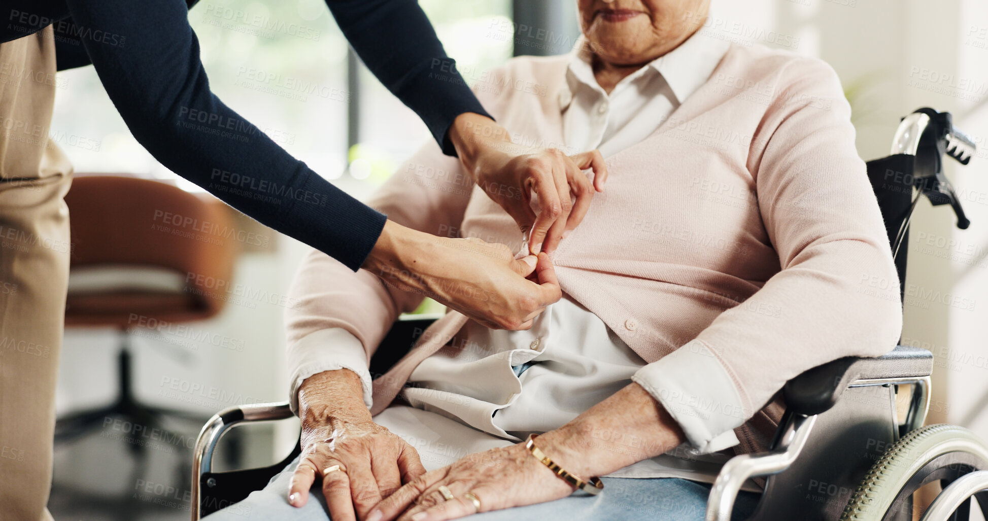 Buy stock photo Help, hands and nurse dressing old woman in wheelchair for hygiene, personal care or support. Clothes, senior person with disability and carer with buttons for assisted living, assistance or service