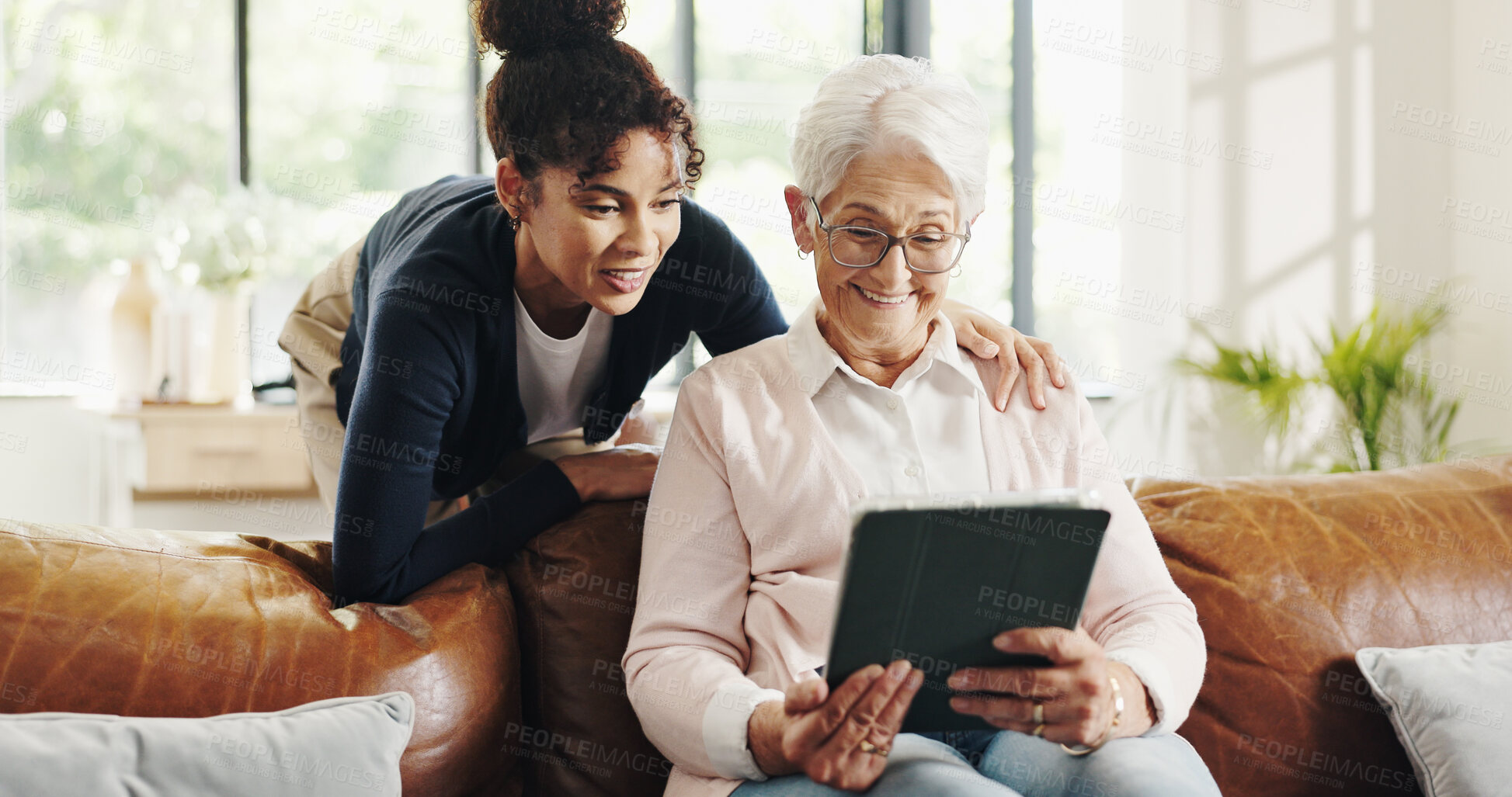 Buy stock photo Old woman, nurse and tablet on sofa with smile for streaming, video or article in living room. People, caregiver and elderly person with tech, application and relax on couch in retirement at house