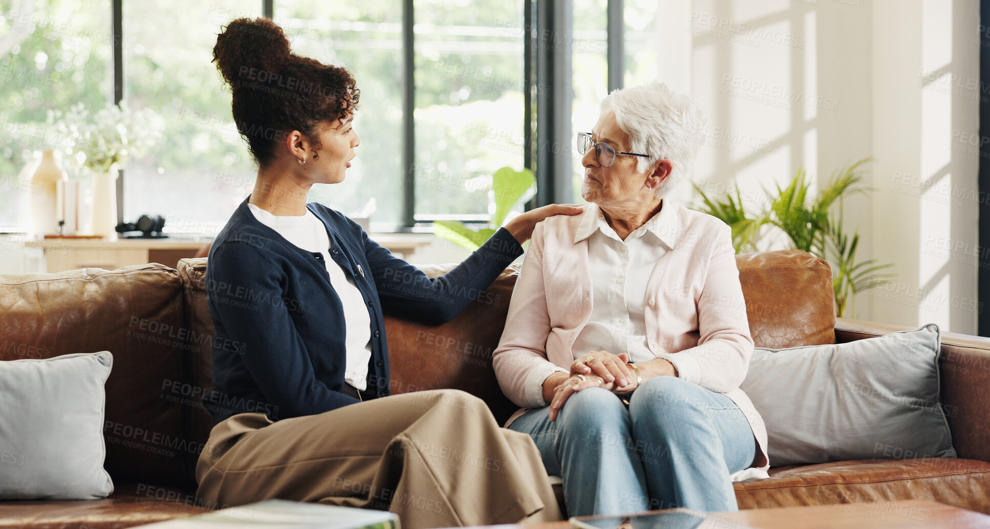 Buy stock photo Conversation, volunteer and senior woman in house for rehabilitation, checkup and post surgery recovery. Apartment, pensioner and caretaker in living room for support, chat and advice for help