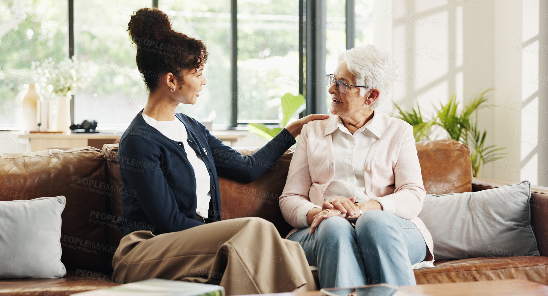 Buy stock photo Chat, volunteer and senior woman in house for rehabilitation, checkup and post surgery recovery. Apartment, pensioner and caregiver in living room for support, conversation and advice for help