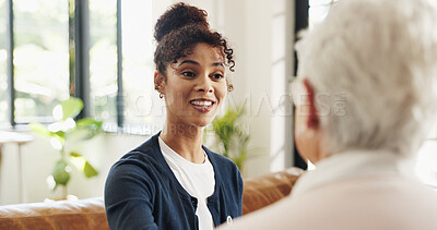 Buy stock photo Nurse, old woman and happy on sofa with talk for checkup, assisted living and support in retirement home. People, caregiver and smile with elderly patient for discussion, consulting or chat in house