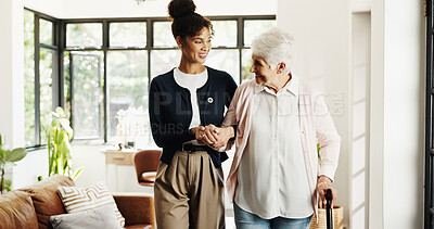 Buy stock photo Nurse, old woman and support with cane in home for mobility, help and balance in retirement. People, caregiver and elderly patient with disability, walking stick or holding hands for rehabilitation