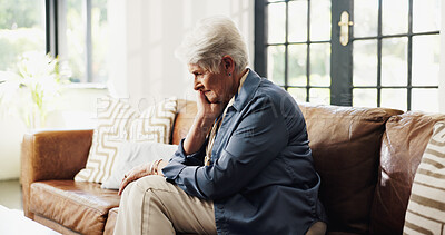 Buy stock photo Old woman, sad and thinking on sofa in home with reflection, memory or trauma in living room. Elderly person with depression, mental health and grief on couch in lounge with retirement at house
