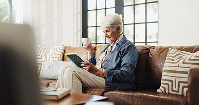 Buy stock photo Coffee, tablet and elderly woman in home for reading news, email or relax on sofa in retirement. Tea, technology and senior person in living room for online article, ebook or happiness on weekend