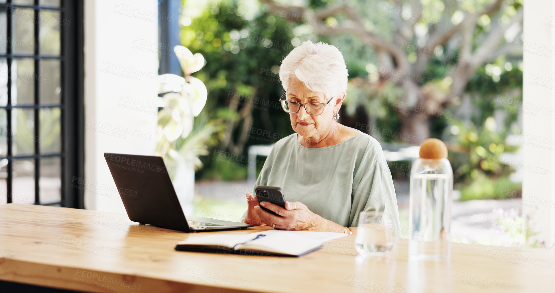 Buy stock photo Woman, phone and typing with laptop for remote work, editing article and creative process in home. Project proposal, freelance writer and notebook for feedback and mature editor or story proofreading