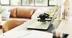 Empty, home and laptop on desk for remote work for creative career, copywriting and online editing. Freelance, hybrid and computer in house with headphones for planning, research project and job