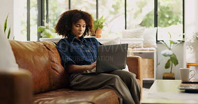 Buy stock photo Laptop, typing and black woman on sofa for remote work, story review and feedback in home. Freelance, hybrid worker and person on couch with computer for digital submission, copywriting and planning